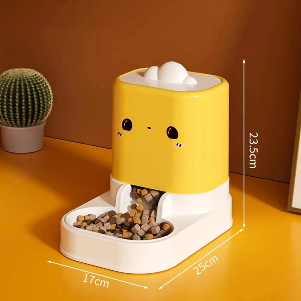 Distributeur croquettes automatique jaune avec gamelle, dimensions 17x25x23,5 cm, fond orangé