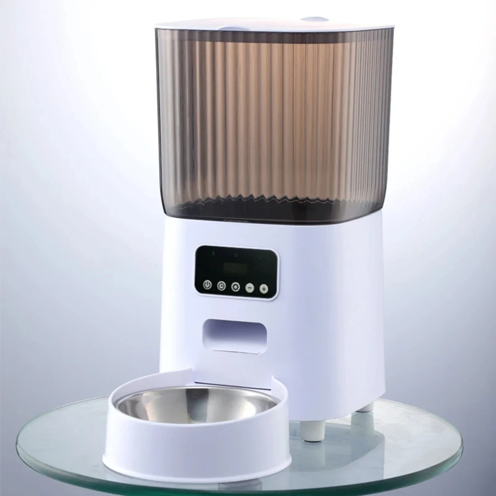 Distributeur croquettes automatique blanc avec une gamelle inox sur socle rond en verre
